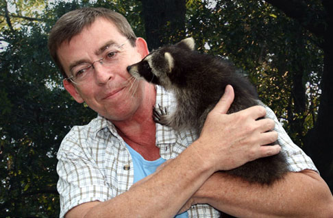 Peter G with a baby raccoon.